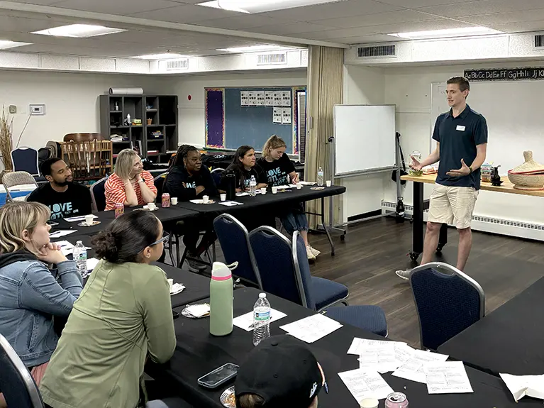 Joe Nowland, a Friends of Refugees staff member, leads an Introduction to Friends of Refugees workshop for a group of volunteers.